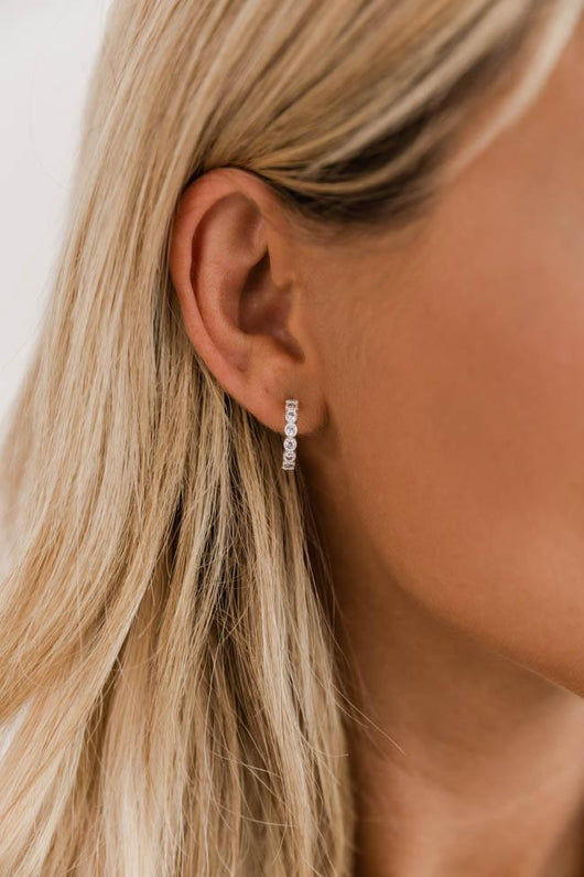 Twirling Through Time Silver/Diamond Huggie Earrings